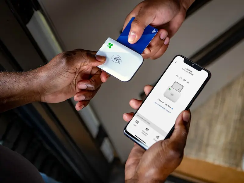 A chip card goes into a Clover Go reader paired with a phone